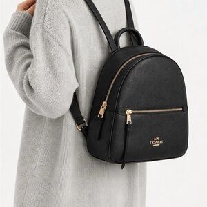 Coach Elegant Black Backpack with Gold Details